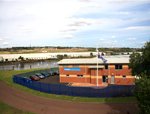 Accommodation building in use with sailors in background